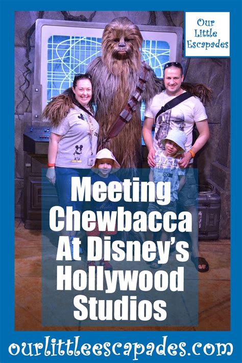 Three People Standing In Front Of A Tv With Chewbacca At Disneys