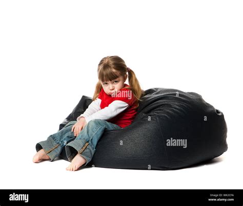 Little Girl Sitting In A Bean Bag Stock Photo Alamy