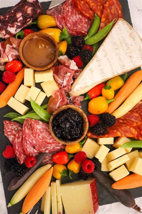 Charcuterie is a french term for a branch of cooking devoted to prepared meat products, such as bacon, ham, sausage, terrines, galantines, ballotines, pâtés, and confit, primarily from pork. How To Make The Perfect Charcuterie Board - GoodFoodBaddie