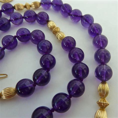 Adorned with five polished, 14k gold beads arranged in a graduated pattern, this everlasting gold necklace is sure to brighten your look. Exquisite 14K Gold 10mm Amethyst Bead Necklace Hand Knotted : Susabella's | Ruby Lane