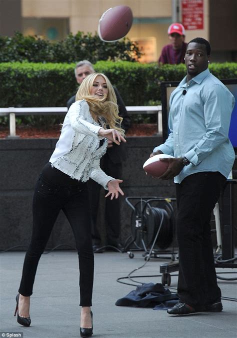 Kate Upton Proves That Anything Can Be Done In Heels As She Tosses A Football Around In