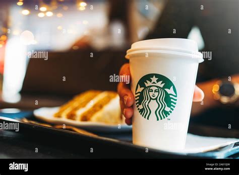 New York, USA - November 5, 2019 : Woman drinking a tall Starbucks