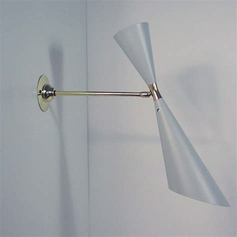 By installing the wall sconces in this manner, it offers a minimalist approach to both the atmosphere of the space as well as the dimensions of the room. Mid-Century French 1950s Diabolo Wall Light Sconce from ...