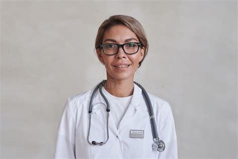 Female Doctor Smiling At Camera Stock Image Image Of Serious