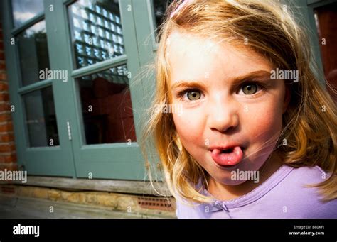 Making Little Girl Faces Tongue