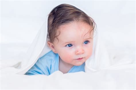 Premium Photo Baby Covered In Blanket