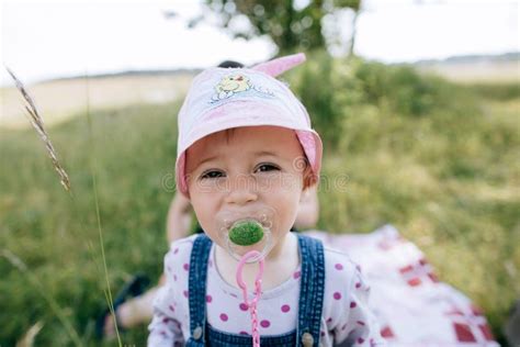 Funny Little Girl With A Pacifier In Her Mouth Stock Image Image Of