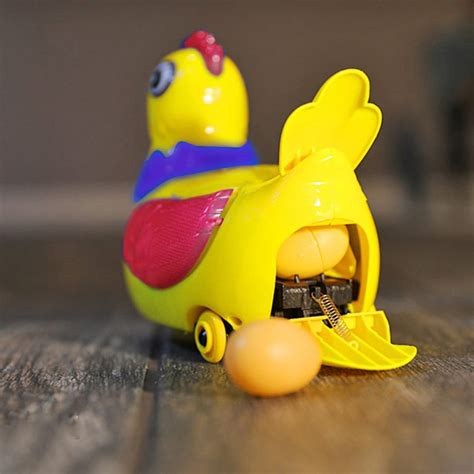 This Robotic Chicken Toy Dances Around And Randomly Lays Eggs Around