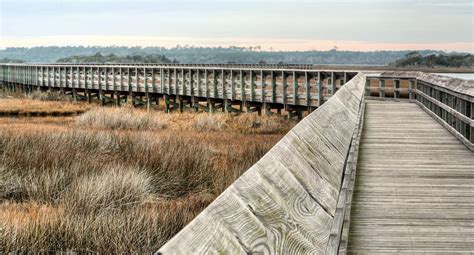 Better surfing during incoming tide or right before high tide. The Walkway Photograph by JC Findley