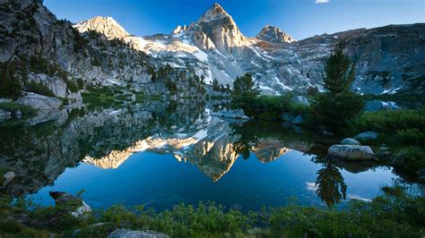 Mountains Reflected In The Crystal Clear Water Backiee