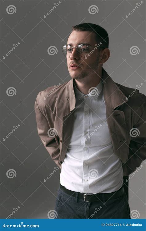 A Lonely Handsome Guy In A Raincoat And Glasses With Different Moods