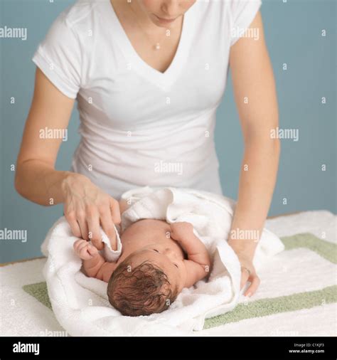 Mother Drying Newborn Baby After A Bath Stock Photo Alamy