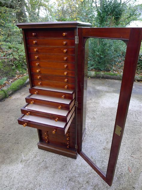 A 20 Drawer Satin Walnut And Mahogany Collectors Cabinet By Messrs