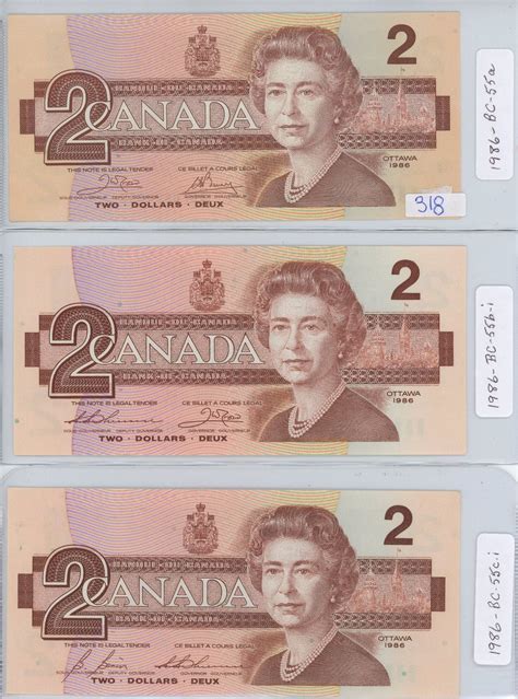 THREE 1986 CANADIAN TWO DOLLAR BILLS - Schmalz Auctions