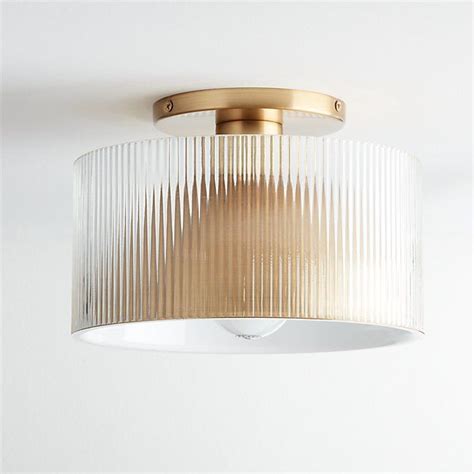 A Light That Is On The Ceiling With A White Wall Behind It And A Round Glass Shade Hanging From