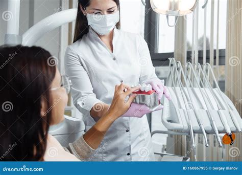 A Woman Is Preparing For A Dental Examination Woman Having Teeth Examined At Dentists Stock
