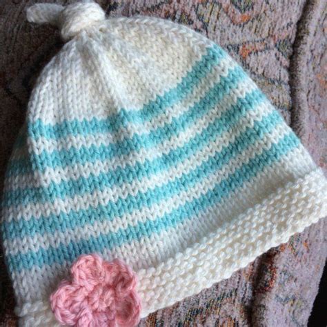 Tegan Baby Hat With Top Knot Knitting Pattern By Julie Taylor