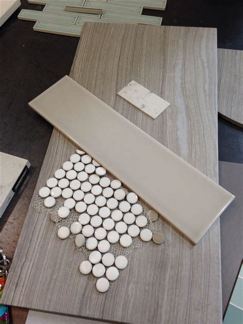 Tile for master bath: penny tiles for shower floor, large ceramic tiles