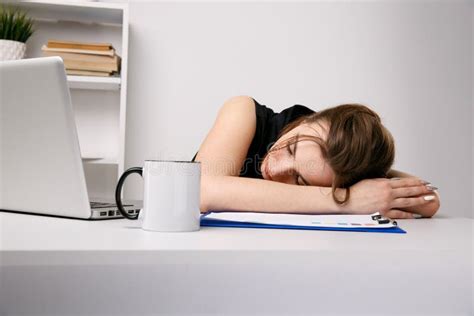 Exhausted Woman Sleeping At Her Office Desk Near The Computer Stock Image Image Of Dream