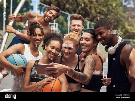 Basketball Is Their Shared Interest A Group Of Sporty Young People Taking Selfies Together On A