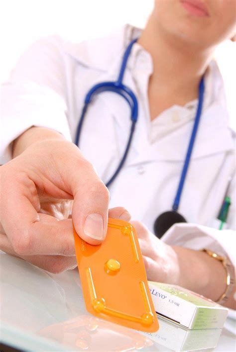 Emergency Contraception Doctor Holding A Packet Containing An Emergency