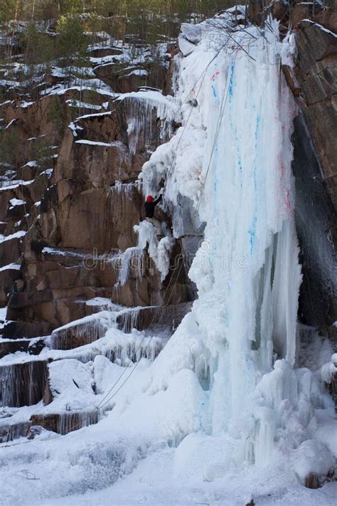 Rock Climbers Climb A Frozen Waterfall Vertical Sheer Rock Climbing