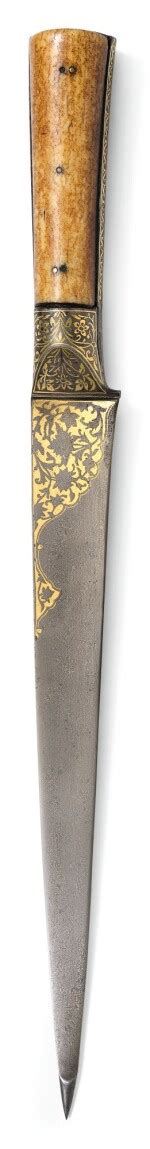 a large watered steel and gold inlaid dagger kard with marine ivory hilt persia safavid