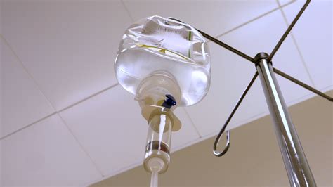 Patient On A Drip Looking Up At Drip Bag From Hospital Bed Hamodia