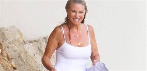 Christie Brinkley 65 Looks Half Her Age In Magenta Swimsuit On Beach