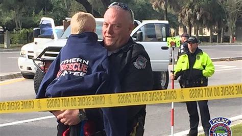 Heartwarming Photo Shows Sarasota Police Officer Comforting Child After
