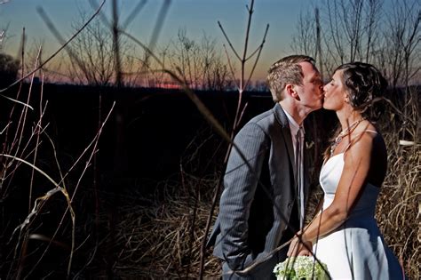 Bride And Groom Kiss Outside During Sunset Captured By Kansas City