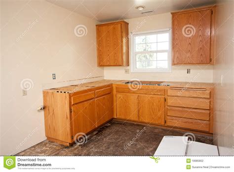 Kitchen peninsula without cabinets underneath google search countertops hardwood floors in kitchen granite countertops. Kitchen Cabinets Without Countertop Stock Photo - Image of ...