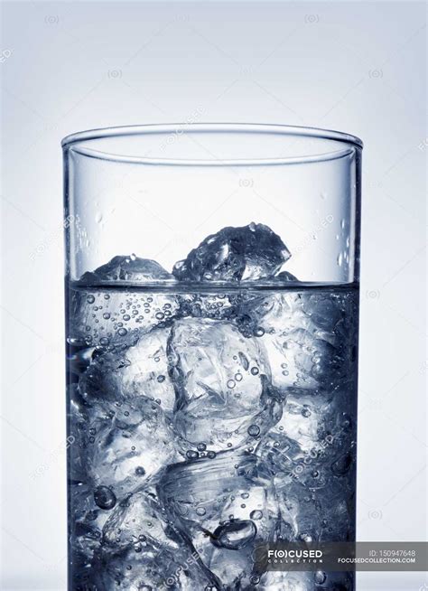 Ice Cubes In Glass Of Water — Aaa Shiny Stock Photo 150947648