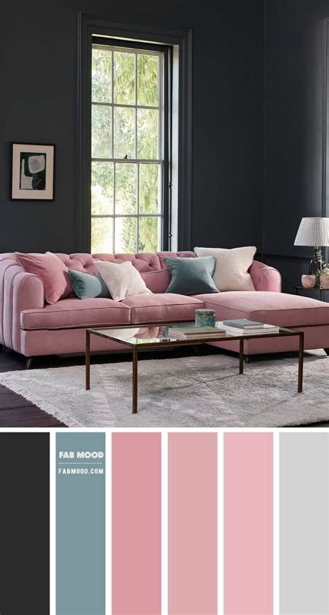 A Living Room With Black Walls Pink Couch And Gray Rugs On The Floor