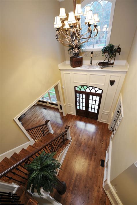 A View Of The Above Foyer From The Top Of The Staircase Landing Showing The Shelf Above The