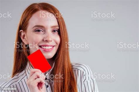 Attractive Redhead Caucasian Businesswoman Wearing Striped Shirt