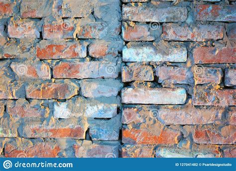 Old Red Brick Wall With Fissures Grunge Texture Background Stock Photo