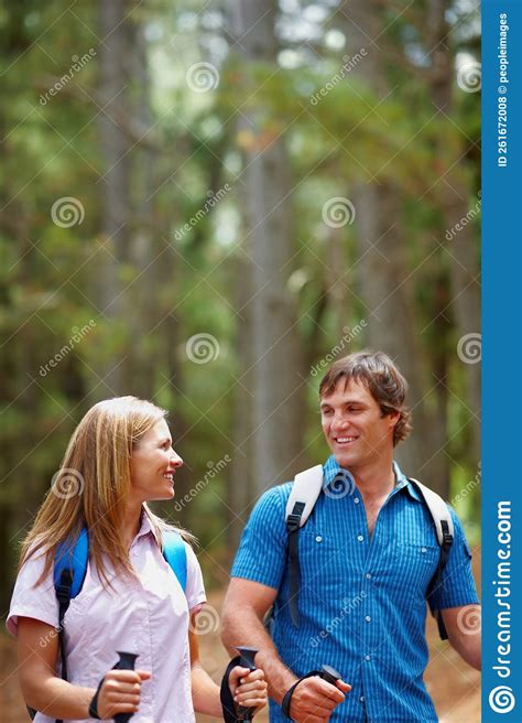 Couple Walking With Hiking Poles Attractive Couple Walking With