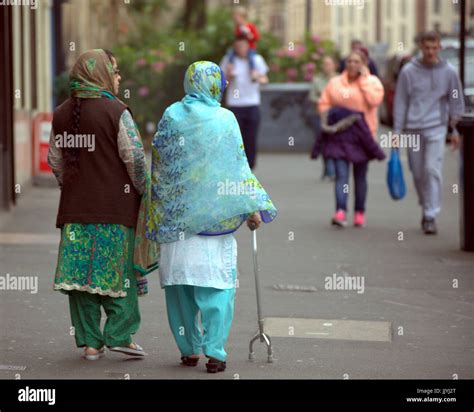 Asian Refugee Dressed Hijab Scarf On Street In The Uk Everyday Scene