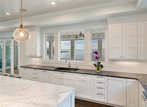 One good example for an all white kitchen is to pair distressed white cabinets with a beige wall and a rich cream colored marble countertop. White Transitional Kitchen Mantoloking New Jersey by ...
