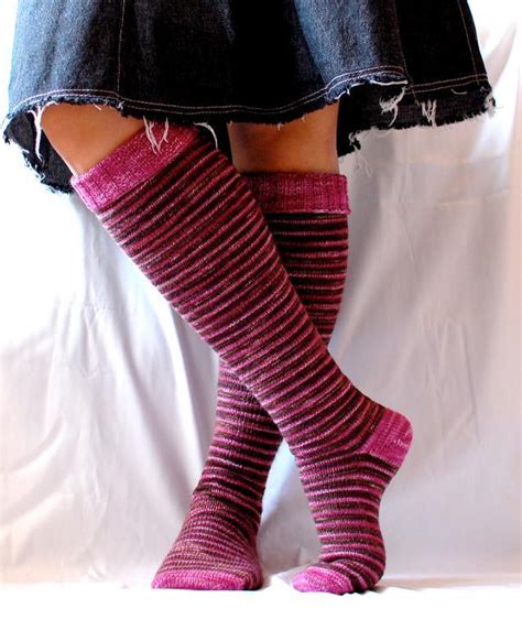 This candy stripe knit sock pattern is a perfect easy knitting pattern for those who have never knitted socks. Knee-High Sock Knitting Patterns for Boots, Heels, and Flats