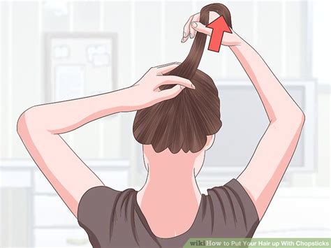 Holding your low ponytail in your left hand, use your right hand to slide one of the chopsticks (pointy end up) diagonally under the ponytail. 3 Ways to Put Your Hair up With Chopsticks - wikiHow