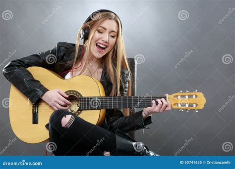 A Beautiful Young Blonde With A Classical Guitar Stock Image Image Of