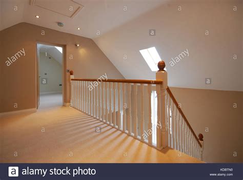 Landing And Wooden Stairs With White Wooden Spindles And