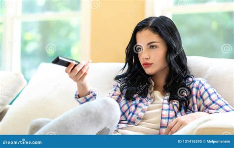 Young Woman Holding A Tv Remote Control Stock Image Image Of Pretty