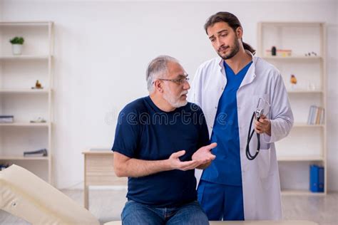 Old Male Patient Visiting Young Male Doctor Stock Image Image Of