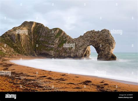 The Distinctive Limestone Arch At Durdle Door In Dorset On The Jurassic