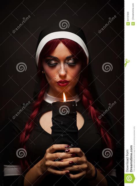 This can be difficult for candles with. Nun with a candle in hands stock photo. Image of woman ...