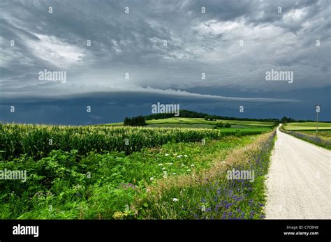Storm Clouds Over A Country Road Stock Photo Alamy