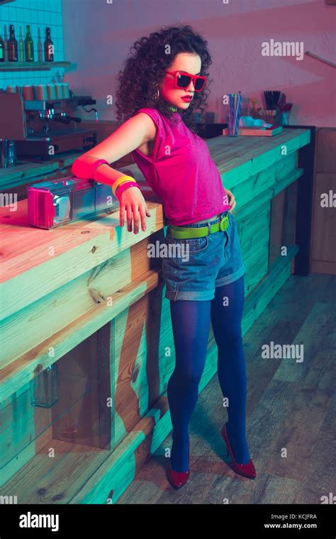 Fashionable Woman Leaning On Counter Stock Photo Alamy